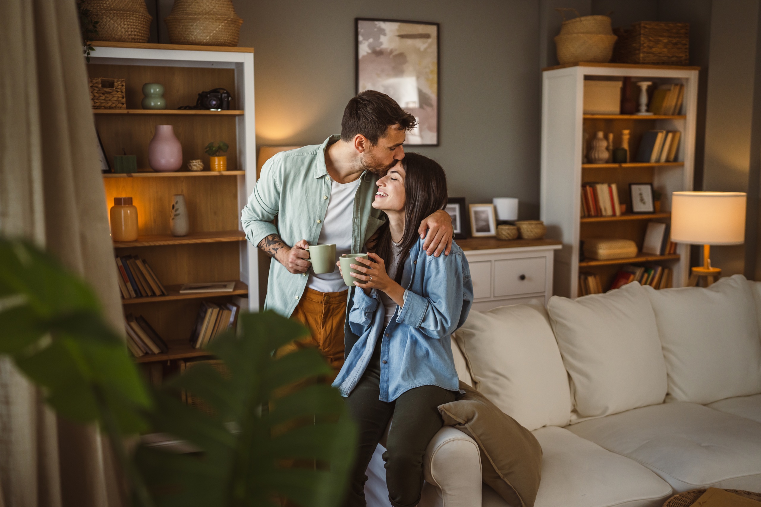 A couple sharing a warm, affectionate moment together at home