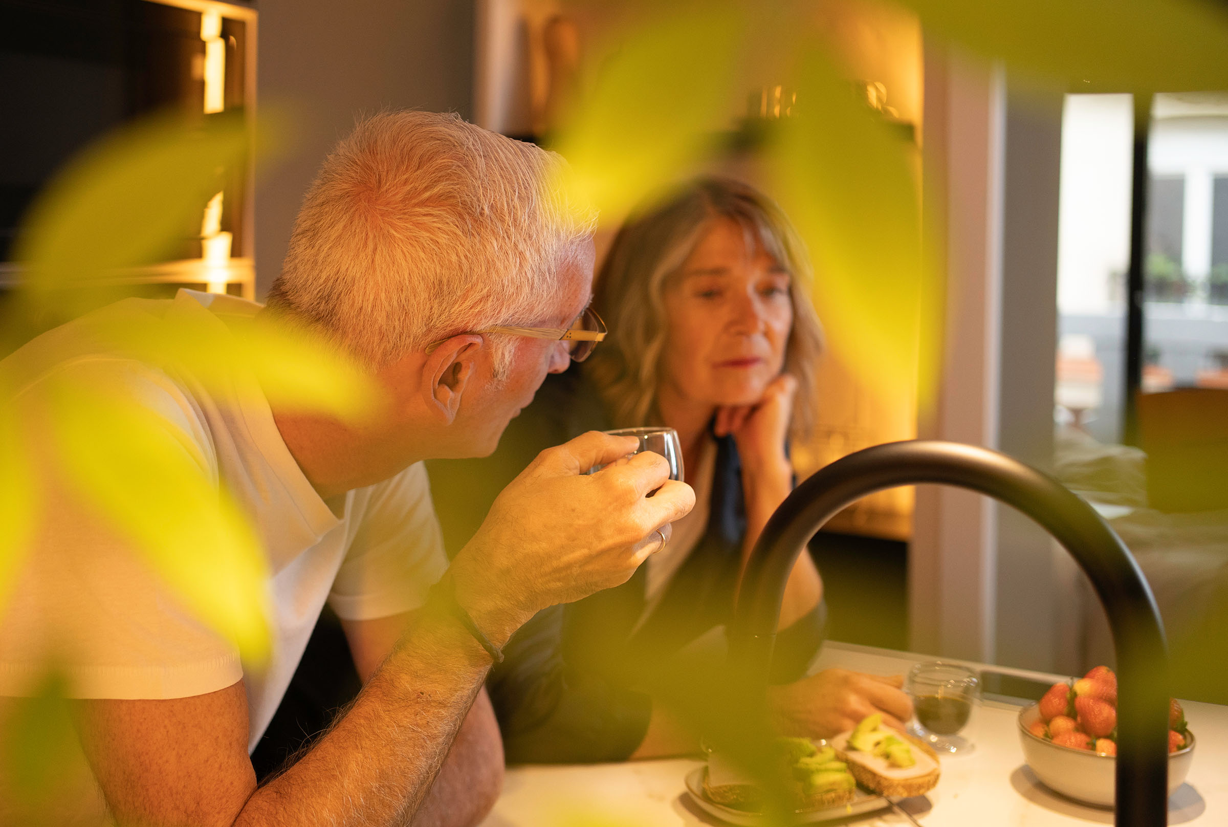 A couple having a focused conversation together at home